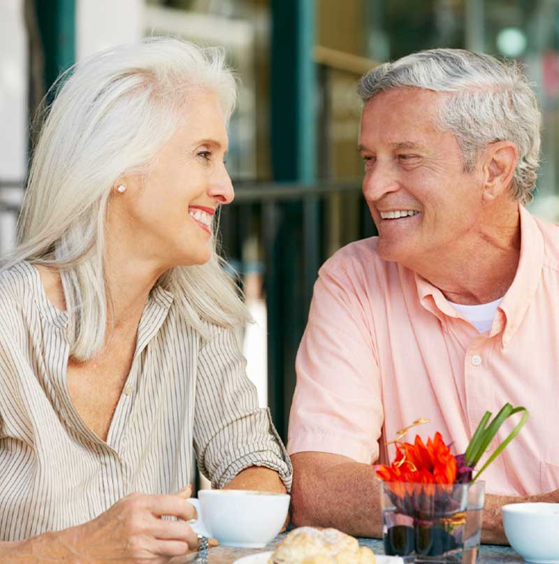 Couple having coffee at an outdoor cafe